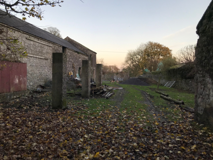 4: View through arch into stable yard east of house