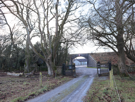 2:Main entrance, c.1845, and railway bridge, from east