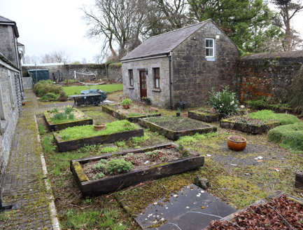 Courtyard east of farm buildings with raised planting beds
