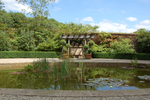 Ornamental garden with circular pool and pergola