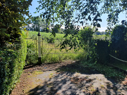 Gate to field to east.